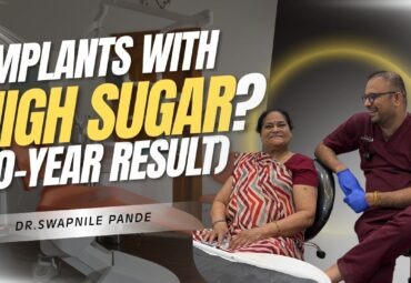 Dental implants with high sugar patient 10 year result by Dr Swapnil Pande implant specialist in Mumbai sitting with elderly female patient in dental clinic
